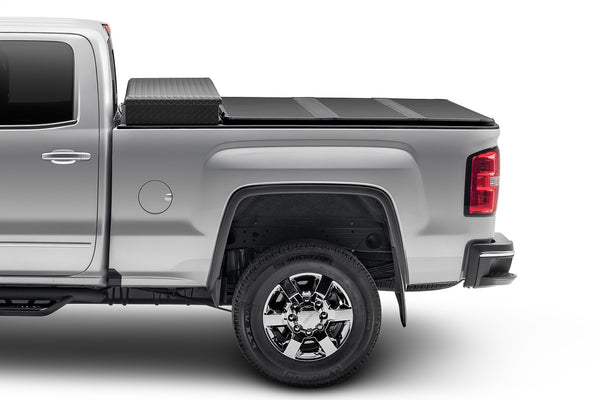 Solid Fold 2.0 Tool Box Tonneau Cover-Black Textured Paint-For Use w/Existing Tool Box-Tool Box Not Included-2009-2018 (2019-2024 Classic) Ram 1500/2010-2024 2500/3500 6ft. 4in. Bed without RamBox