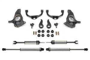 Fabtech Budget Lift System w/Shock 4 in. Lift Incl. Spindles Upper Control Arms Steering Knuckles Torsion Keys Rear Shocks All Required Hardware w/DLSS Shocks - K1056DL